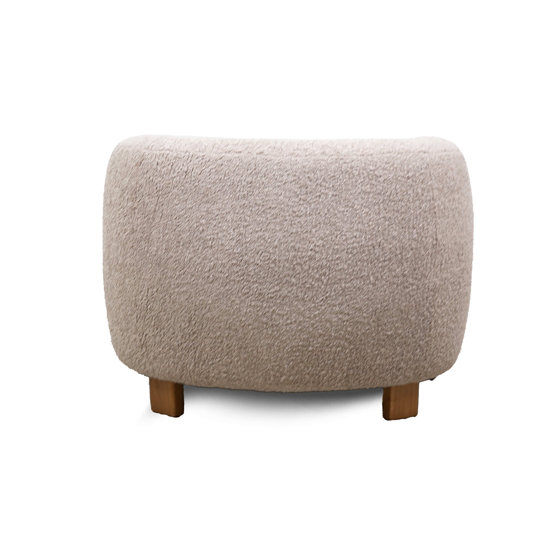 Front view of the Keji Armchair in pebble grey bouclé featuring a rounded silhouette and integrated natural wood frame