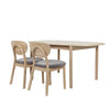 High-angle perspective lifestyle shot highlighting the smooth rounded corners and organic aesthetic of the Runway dining table