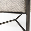 Detailed view of the minimalist Y-shaped metal cross-brace providing structural support to the bench base