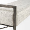 Close-up shot focusing on the seamless connection between the chevron fabric seat and the industrial metal corner frame
