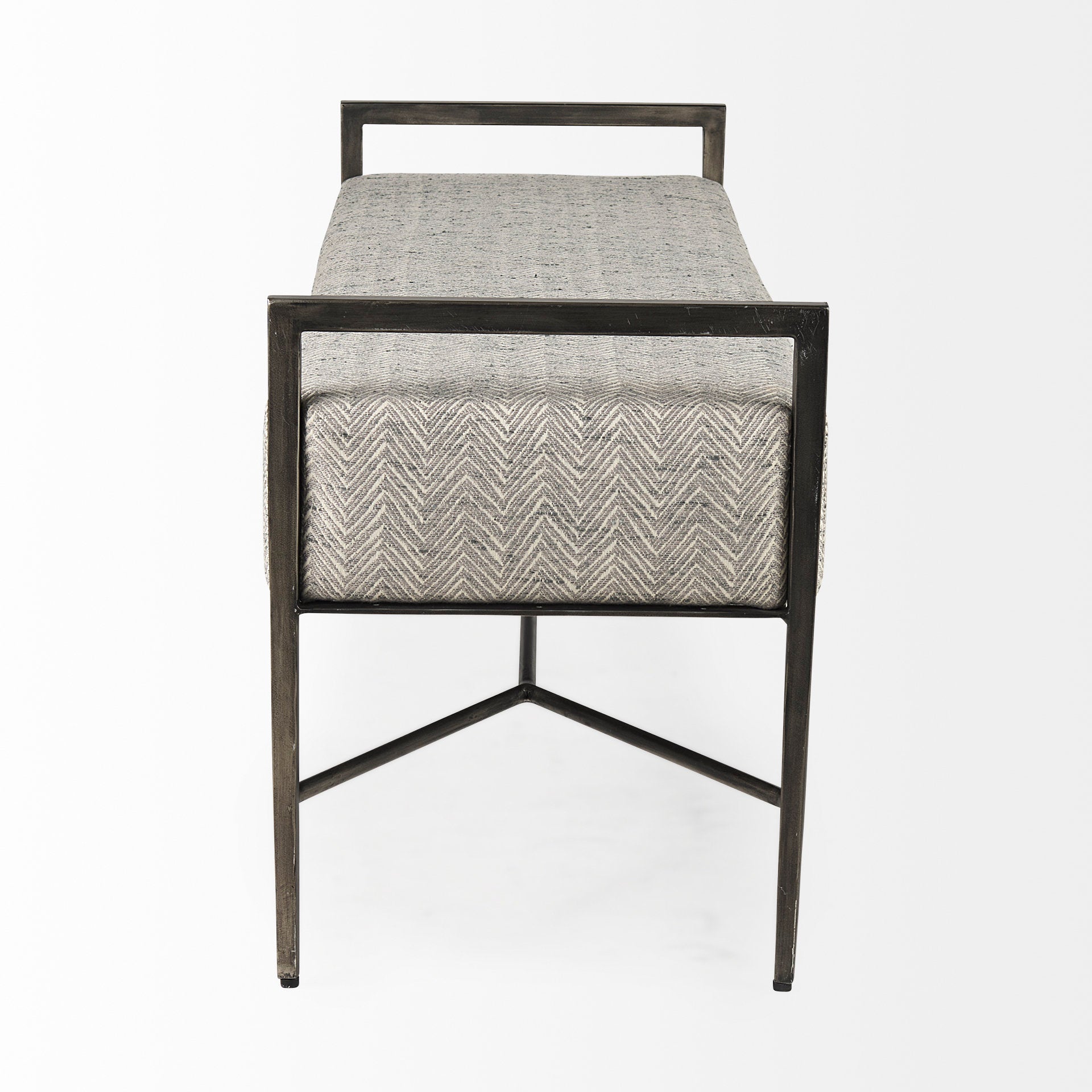 Front view of the Charlotte bench featuring light gray chevron-patterned upholstery and a minimalist black metal frame