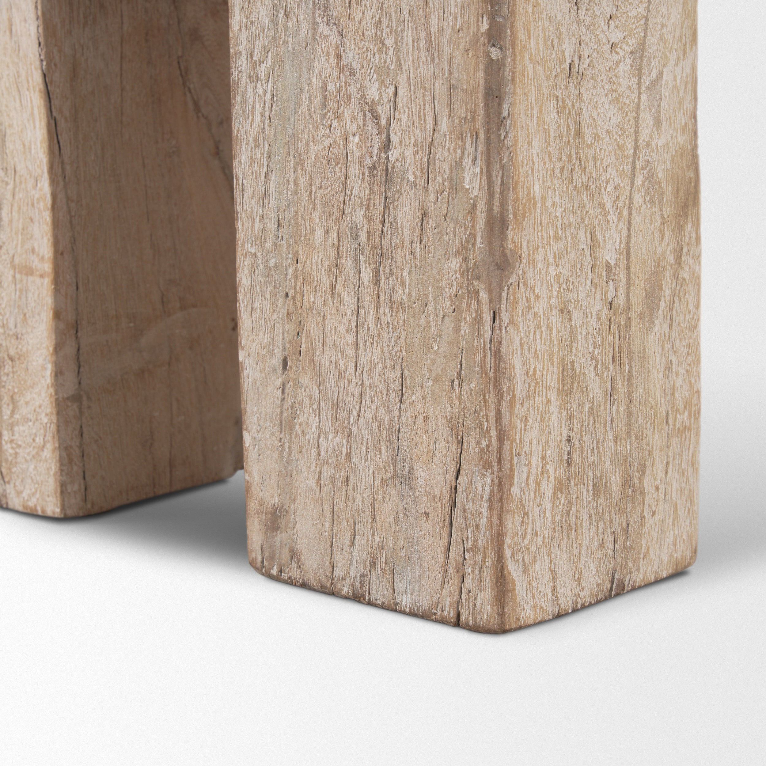 Macro shot showcasing the natural cracks and raw wood character of the thick block legs with a whitewash patina
