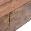 Macro shot focusing on the tactile hand-crafted hexagonal wood tile patterns and gold-tone cylindrical door pulls