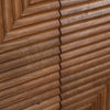 Macro shot highlighting the tactile vertical and diagonal ribbing of the chevron-patterned wood doors