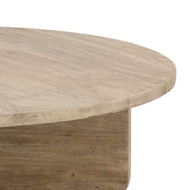 Macro detail shot focusing on the organic wood grain and the rounded corner of the slab pedestal base