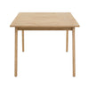 Straight-on side profile view highlighting the slim tabletop depth and the clean architectural lines of the natural oak legs