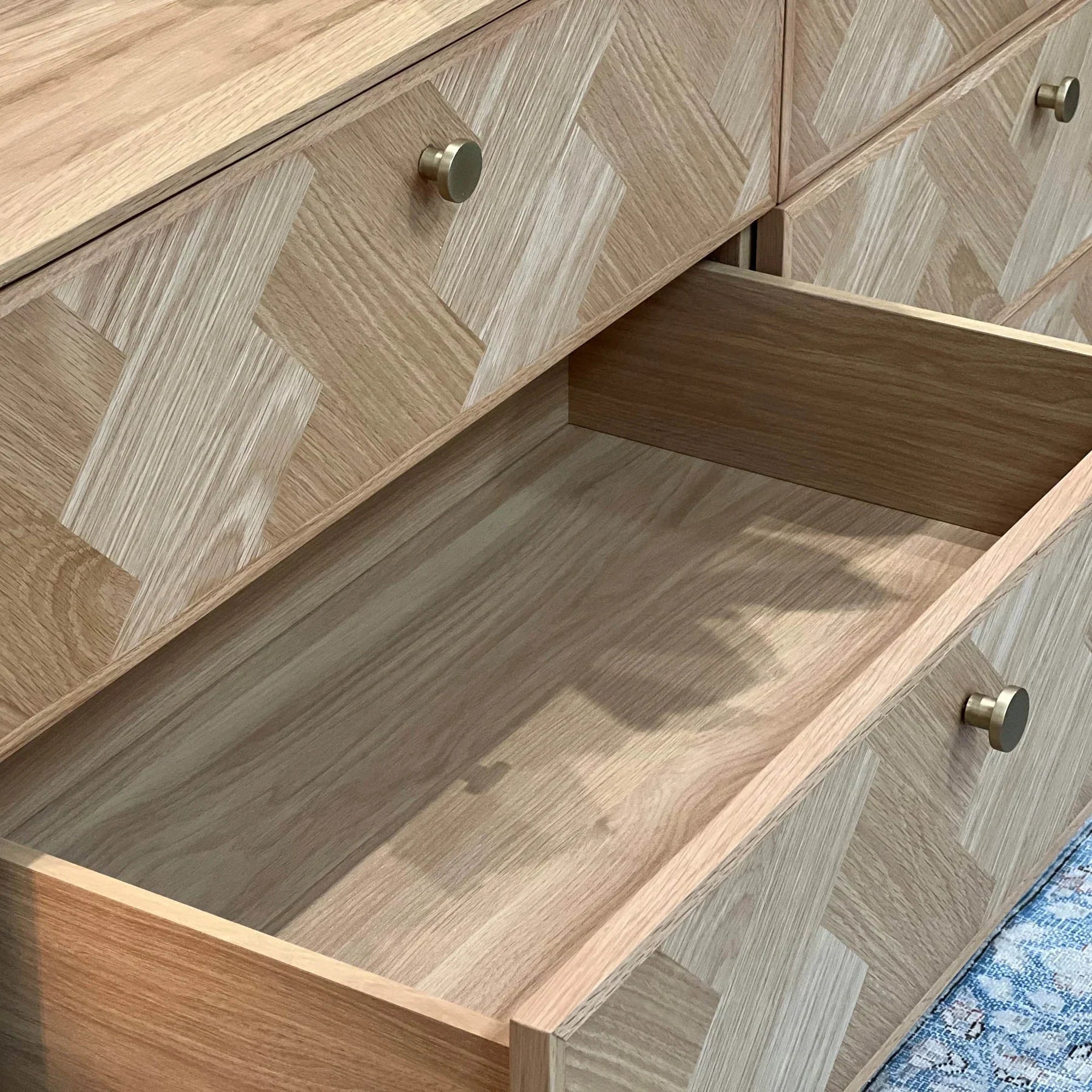 Front view of the Colton 6-drawer dresser in a warm walnut finish featuring vertical fluted wood detailing on the top drawer row