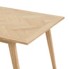 Close-up perspective highlighting the intricate parquet wood grain pattern on the rectangular tabletop surface