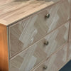 Three-quarter view with all three right-side drawers open showcasing high-capacity storage and smooth internal construction
