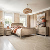 Wide lifestyle shot showcasing the Opera bed alongside its matching light oak dresser and nightstand in a bright master suite