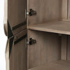 Macro shot focusing on the high-quality adjustable metal hinges and the internal wood finish of the cabinet
