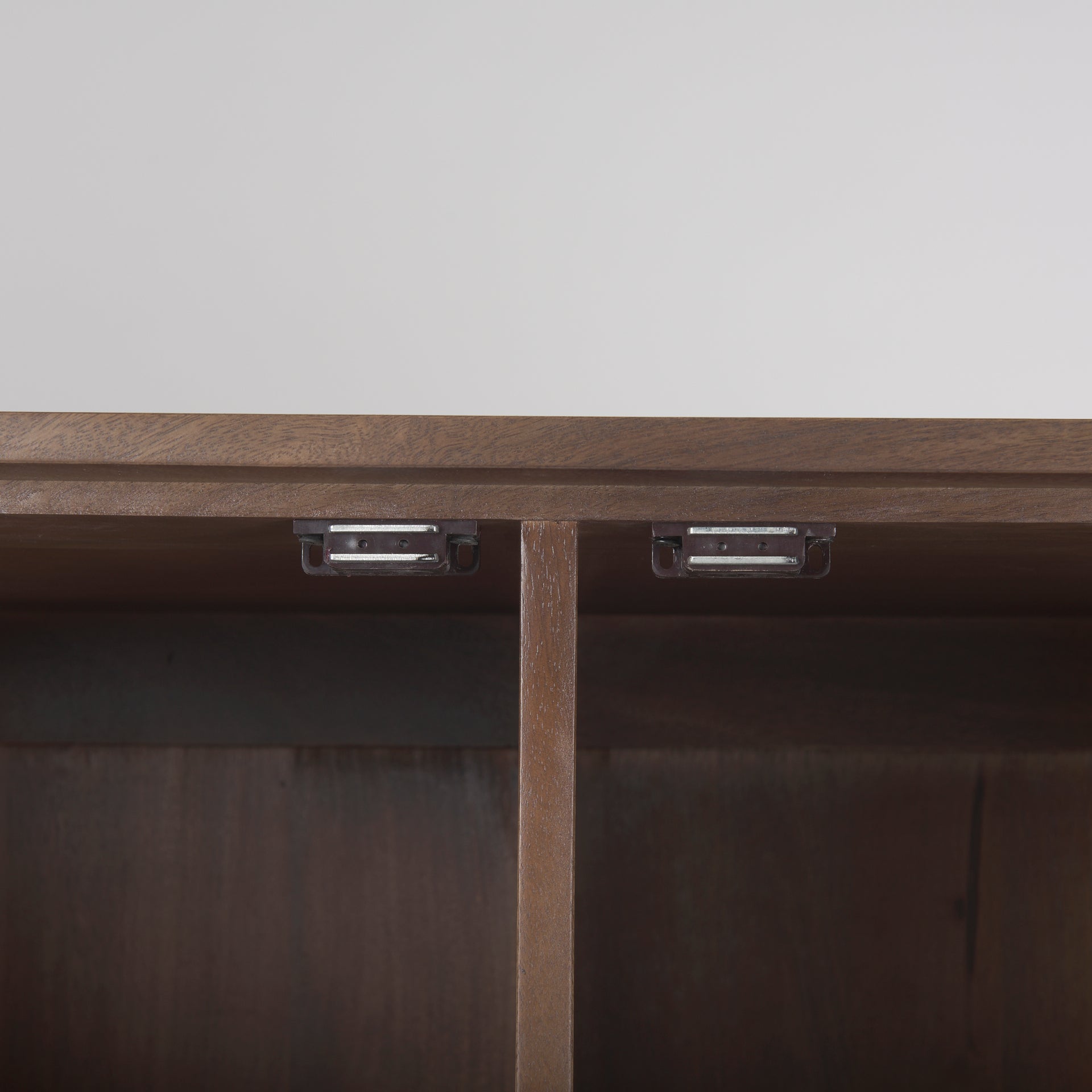 Close-up shot focusing on the high-quality adjustable metal hinges and the smooth internal wood finish of the top frame