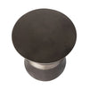 Overhead view of round concrete hourglass side table surface