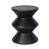 Three-quarter view of the concrete inverted side table featuring a matte black finish and a bold three-tier geometric zig-zag silhouette