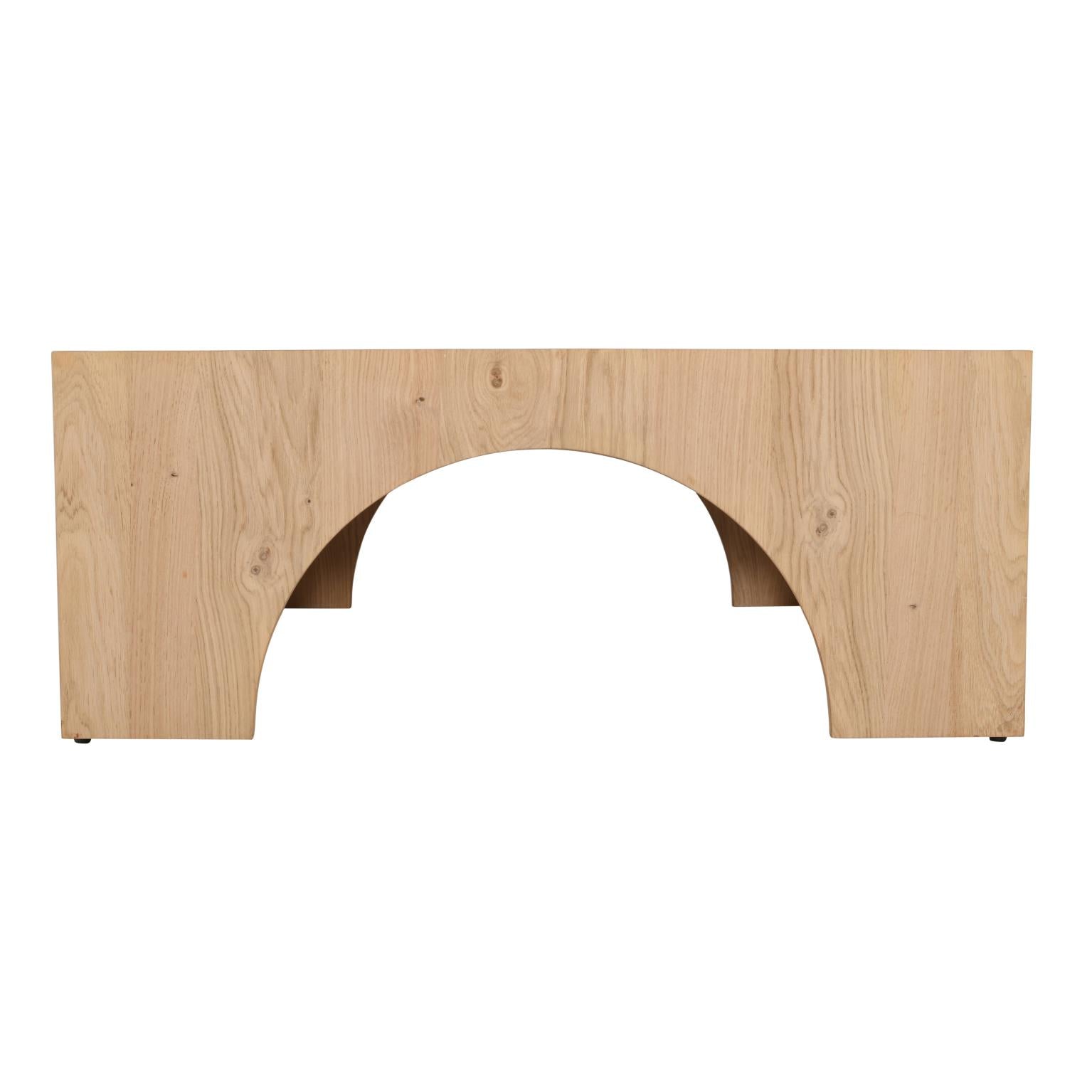 Straight-on front view showcasing the symmetrical arch design and solid wood block construction of the square coffee table