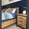 Full room view illustrating the architectural balance of the Irondale nightstand alongside a matching low-profile bed