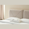 Lifestyle perspective highlighting the headboard as a soft architectural focal point in a clean minimalist master suite