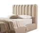Lifestyle shot featuring the Eira storage bed styled with neutral linens and textured pillows in a bright modern bedroom