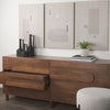 Lifestyle shot featuring the Astrid sideboard styled with minimalist decor and abstract wall art in a modern interior