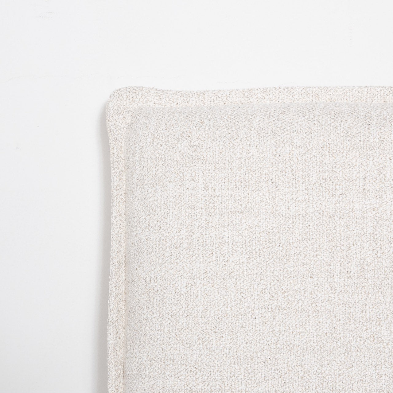Front view highlighting the soft textured upholstery and the clean architectural lines of the bed frame