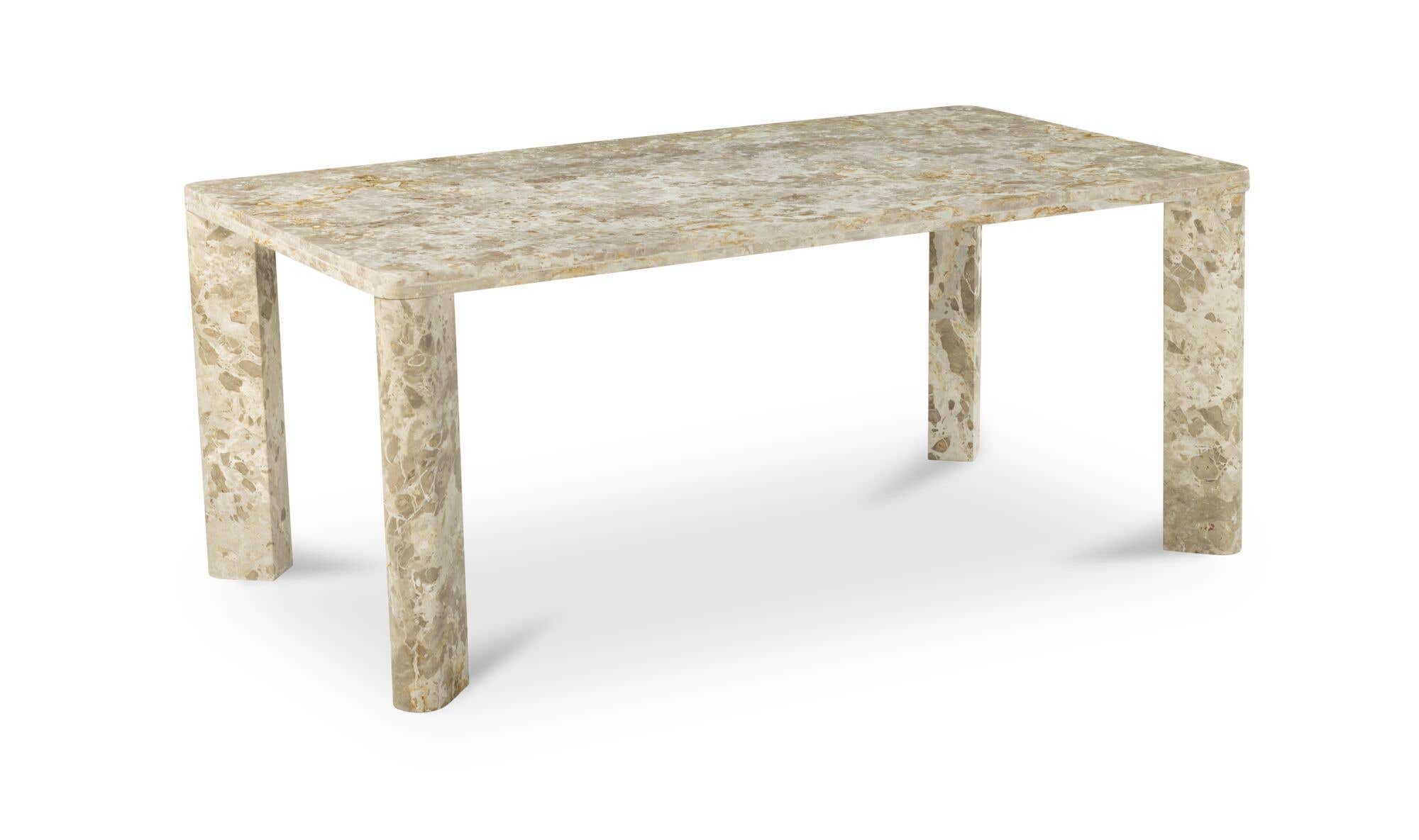 Front view of the Segment dining table in beige panther stone featuring a thick rectangular top and rounded architectural legs