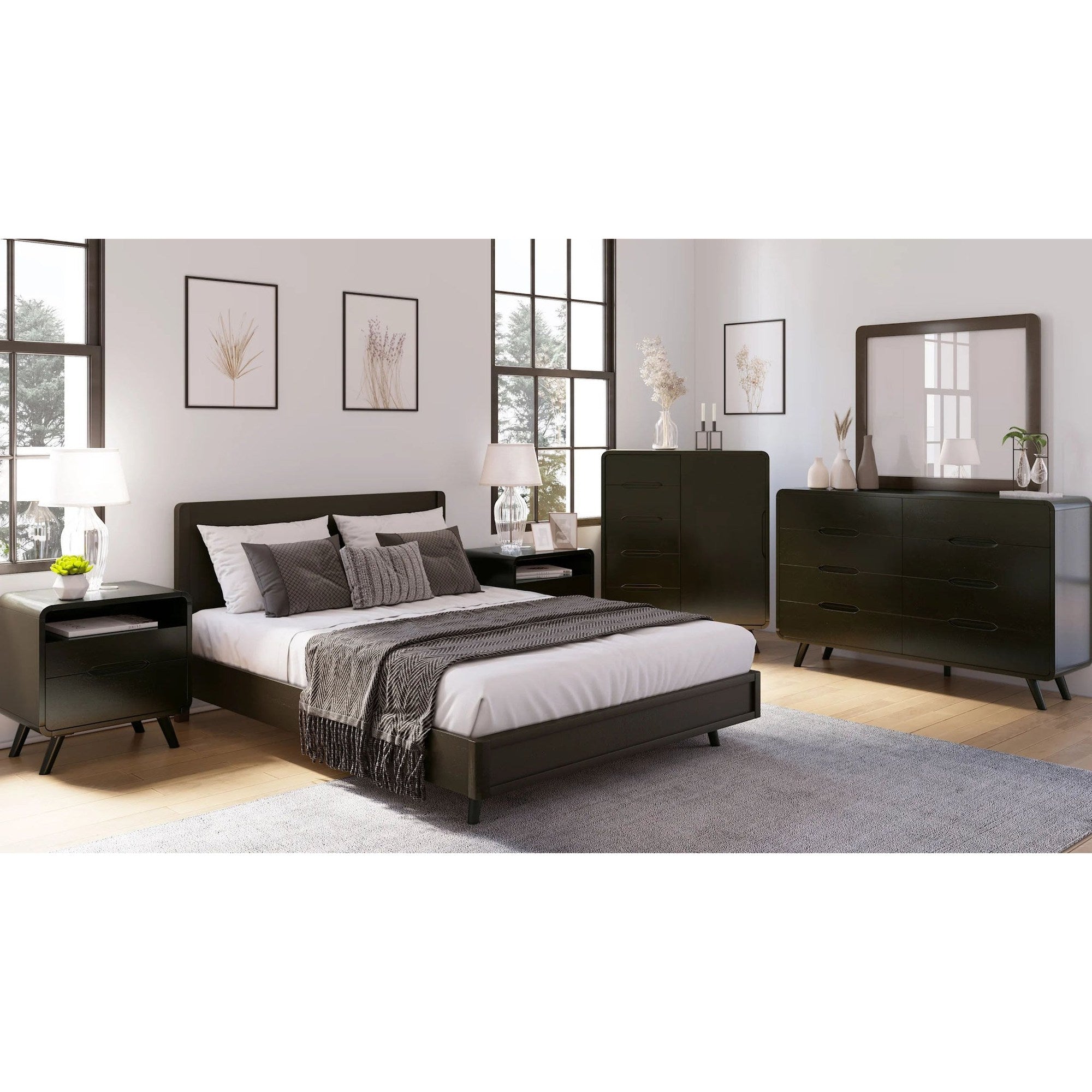 Wide lifestyle shot featuring the Marlowe bed in a master suite alongside matching black dressers and nightstands