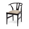 Three-quarter perspective view showcasing the elegant curved silhouette and minimalist black wooden base of the Trixie I chair