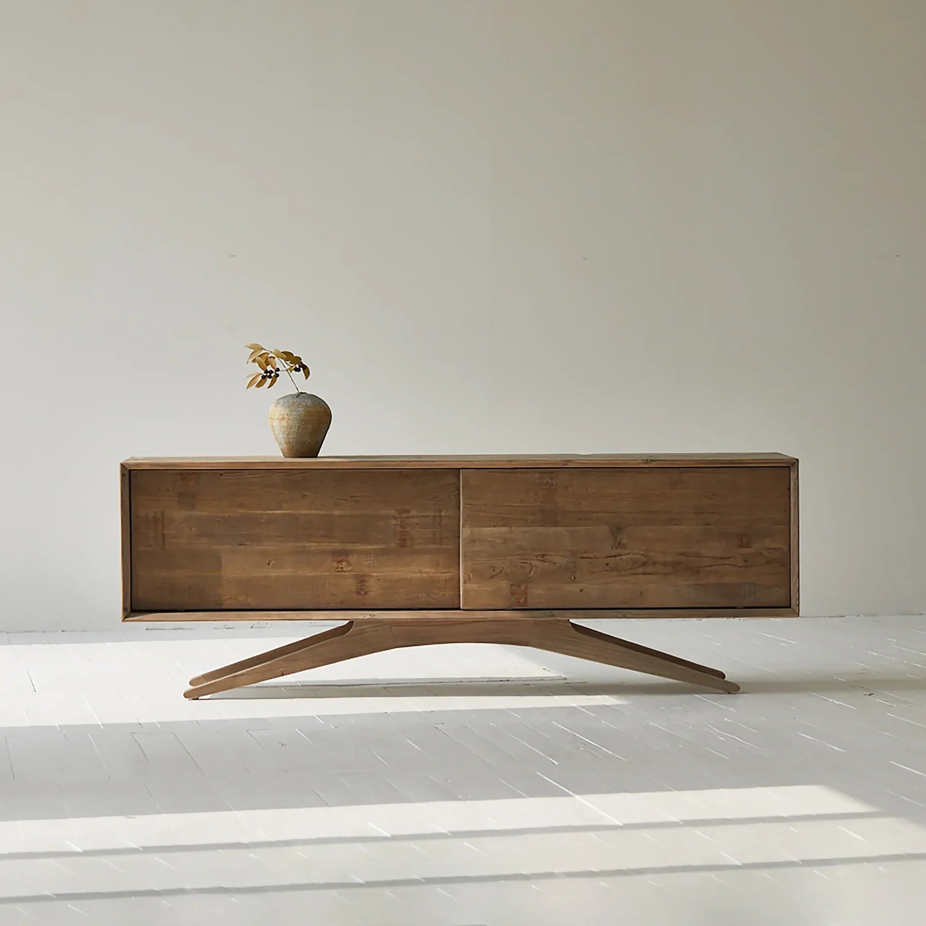 Front view of the Meridian sideboard in a white ash finish featuring three central drawers and two side cabinets with textured horizontal slats