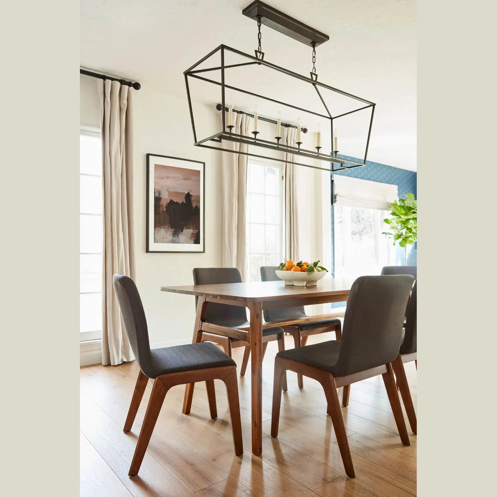Front view of the Remix dining table in a rich walnut-toned acacia wood featuring a minimalist rectangular top and flared tapered legs