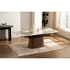 Lifestyle shot showcasing the Hyld table styled in a bright modern dining room with neutral chairs and minimalist decor