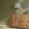 Straight-on lifestyle shot featuring the sideboard as a statement piece in a bright hallway or living area