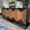 Close-up lifestyle shot featuring the sideboard styled with organic greenery and modern home accessories