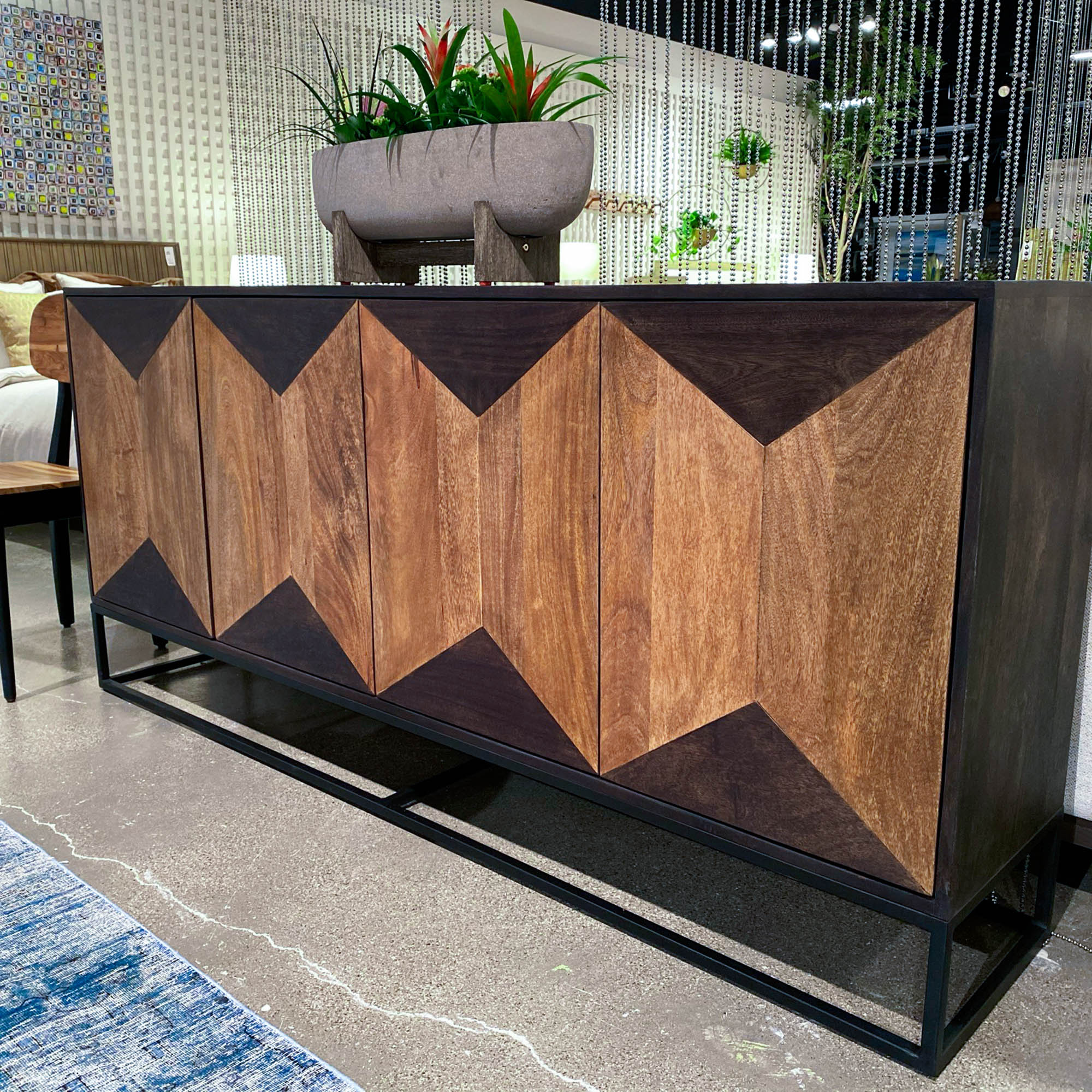 Straight-on front view highlighting the symmetrical geometric diamond pattern and the seamless integration of the cabinet doors