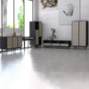 Lifestyle shot featuring the console table used as a slim hallway desk in a bright, modern interior space