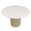 High-angle perspective view showcasing the circular marble tabletop and the architectural vertical fluting of the pedestal base