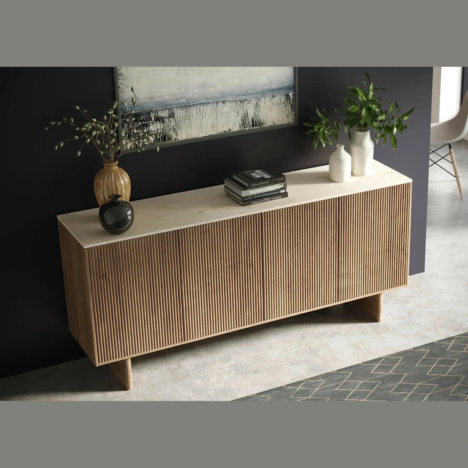 Front perspective view of the Hedron sideboard featuring vertical fluted oak wood panels and a white marble top surface
