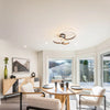 Front lifestyle view of the Sculpture table styled with neutral furniture and warm ambient lighting