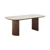 Three-quarter perspective view highlighting the thin beveled edge of the ceramic tabletop and the architectural curved walnut pedestals