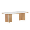 Three-quarter perspective view highlighting the thin oval tabletop and the architectural split-pedestal oak leg design