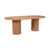 Three-quarter perspective view highlighting the smooth oval tabletop and the architectural texture of the dual tambour pedestals