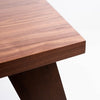 Perspective view highlighting the uniform finish and modern aesthetic of the Bessa rectangular wood table