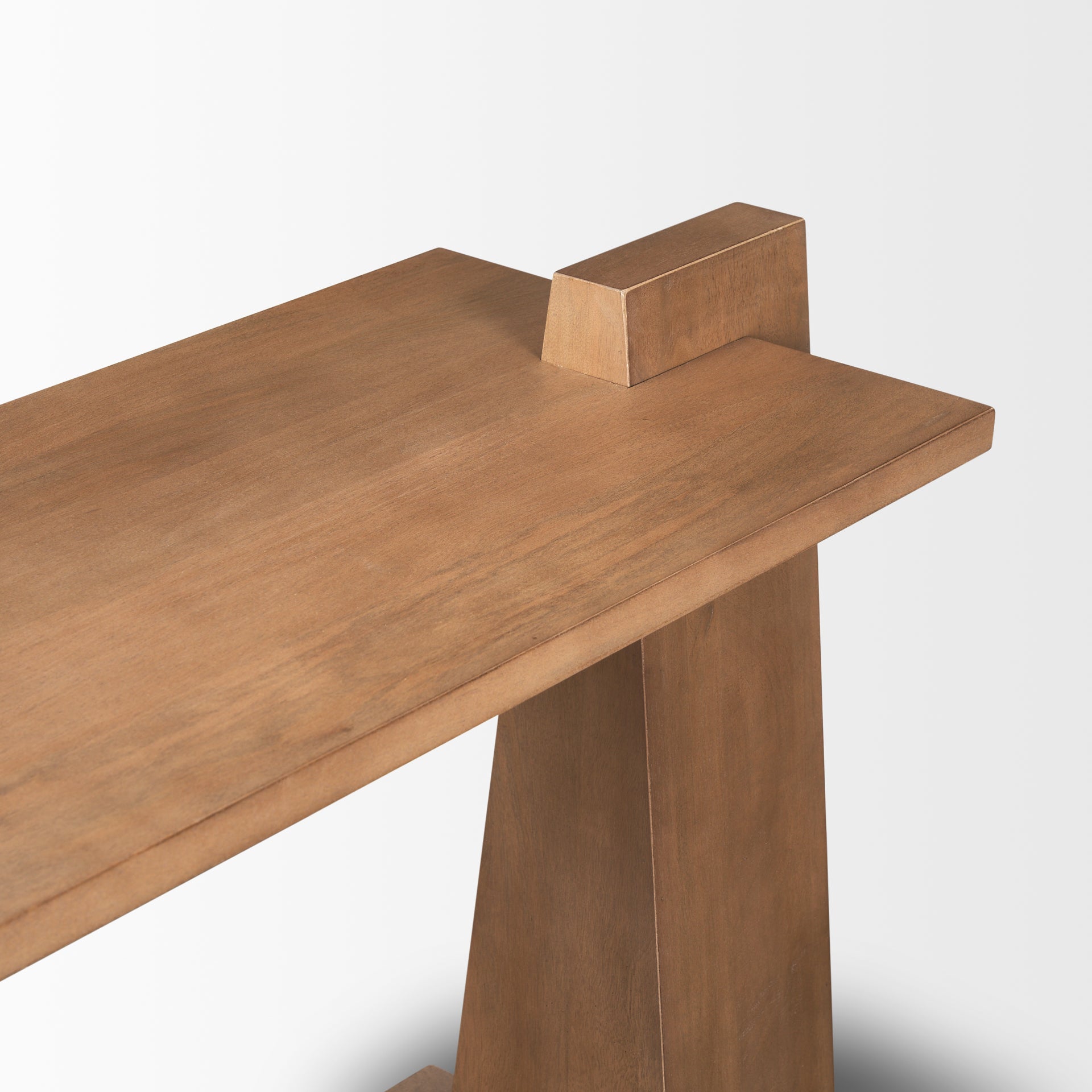 Close-up shot focusing on the high-quality joinery where the flared leg meets the overhanging wood tabletop