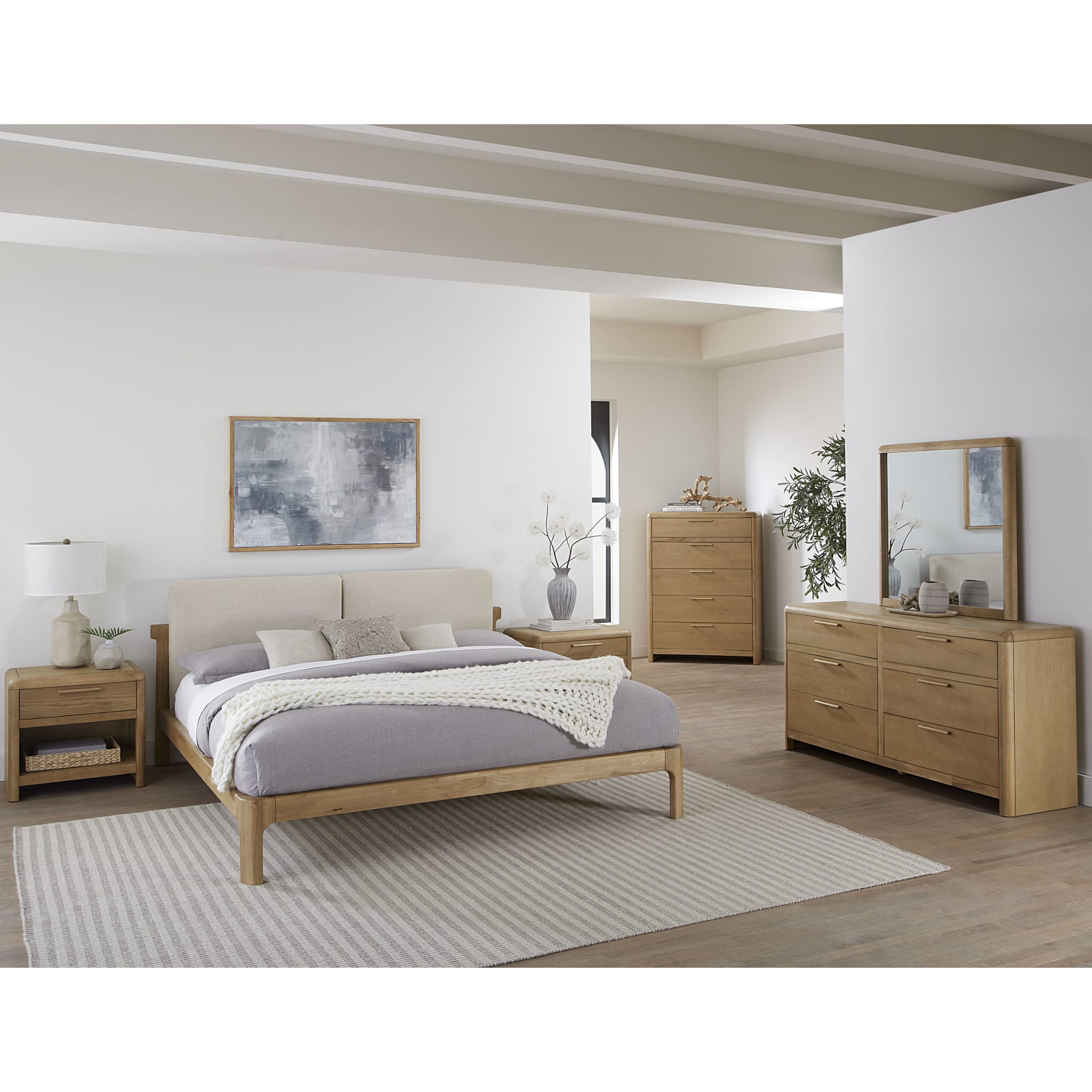 Wide lifestyle shot showcasing the Havn dresser as part of a complete master suite including the matching platform bed and tall chest