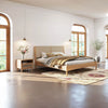 Wide lifestyle shot showcasing the Lumina bed alongside matching light oak furniture in a bright, modern interior