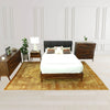 Wide lifestyle perspective showcasing the nightstand as part of a complete bedroom set including a matching dresser and bed