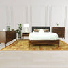 Wide room lifestyle shot showcasing the 6-drawer dresser as part of a complete master suite with a matching bed and tall chest