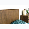 Detail lifestyle shot showcasing the headboard alongside a matching walnut dresser and minimalist decor
