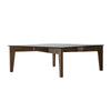 Front view of the Cosimo coffee table in a warm wood finish with the top fully extended for workspace or dining