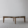 Detailed shot focusing on the natural wood grain texture and the open lower storage shelf for books or decor