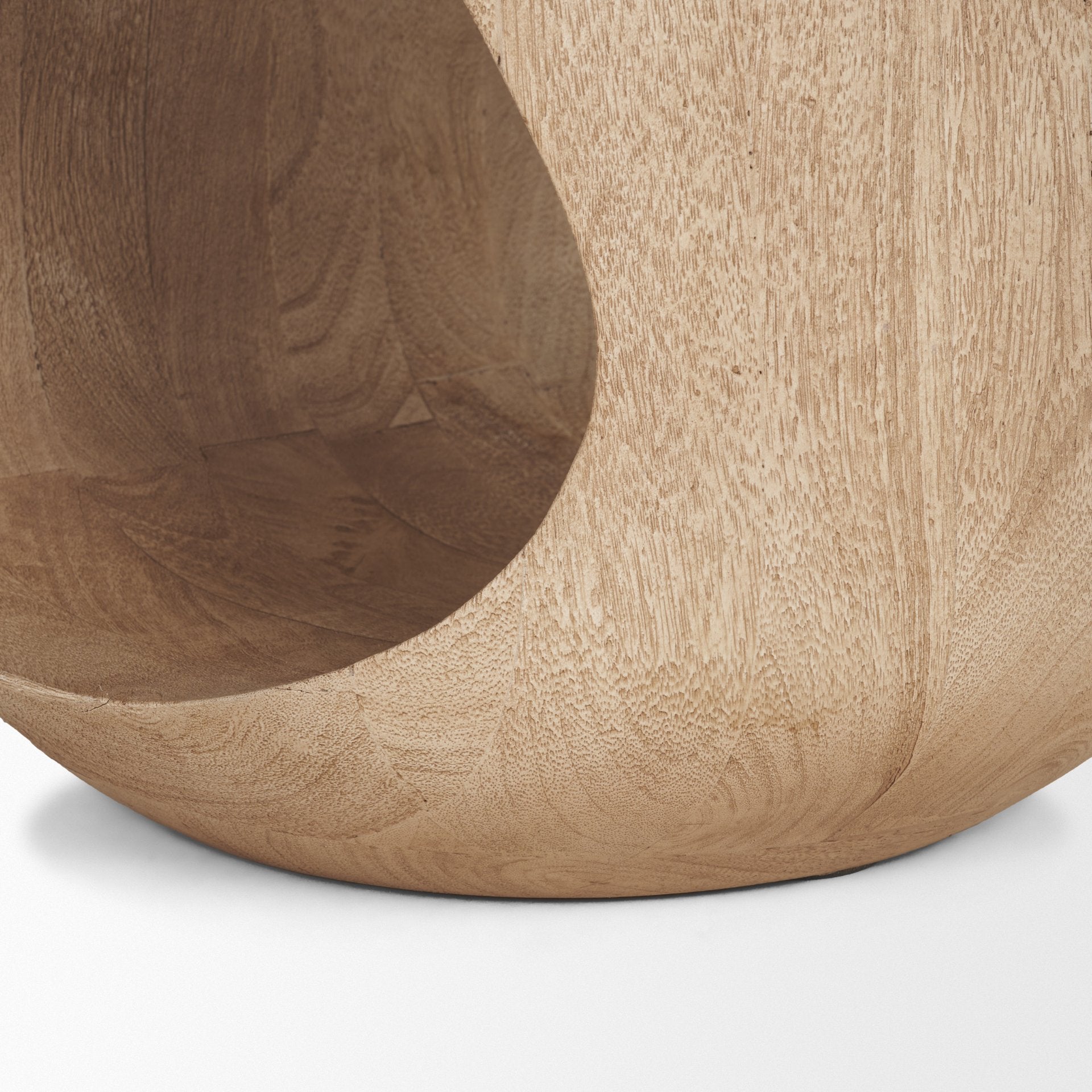 Close-up shot focusing on the smooth sanded edges and interior wood grain of the teardrop-shaped open center